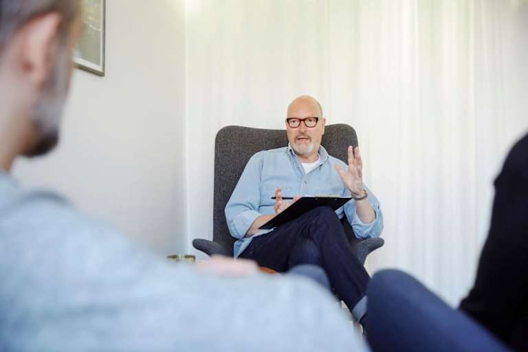 Psychologist talking to patient
