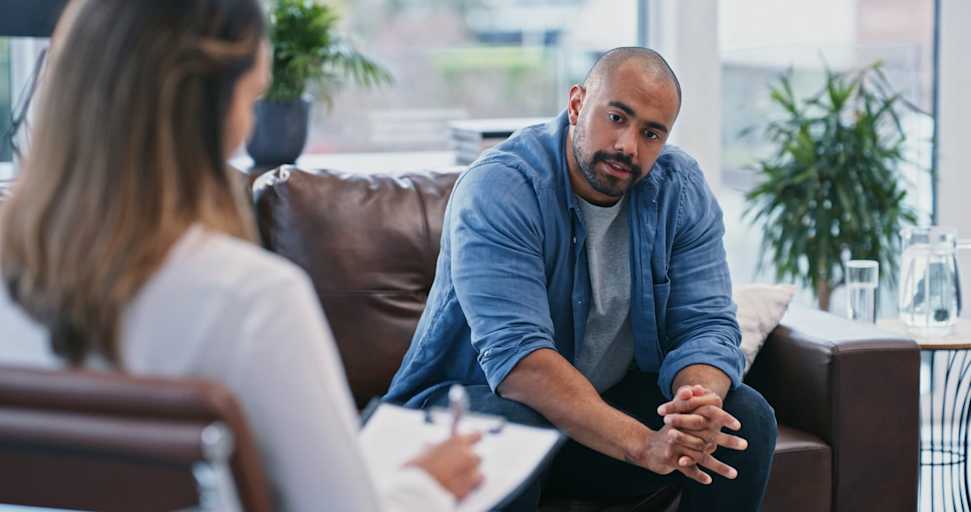 Mental health psychologist talking to patient